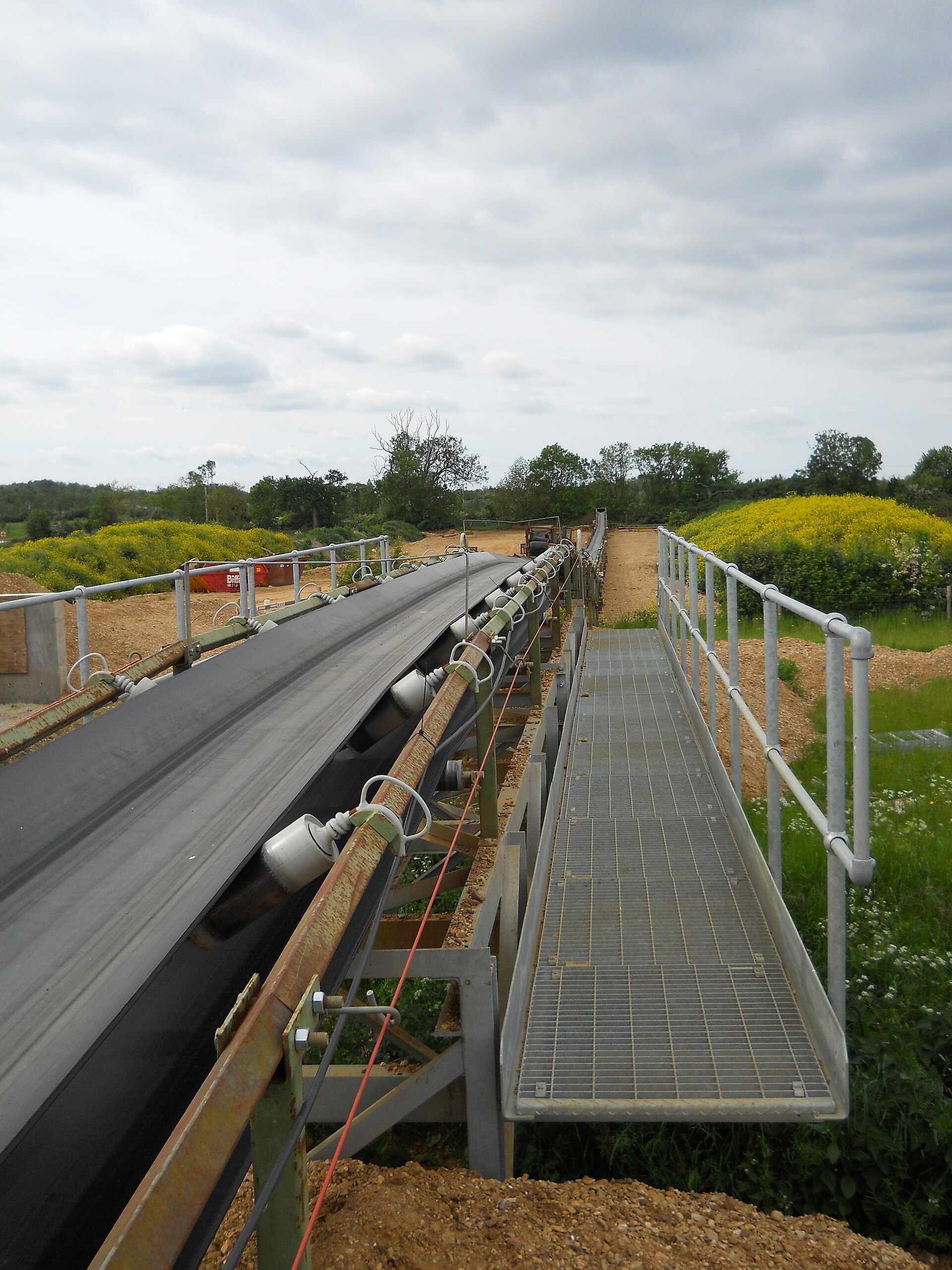 Belt conveyor in a crushing and screening plant, industry scene