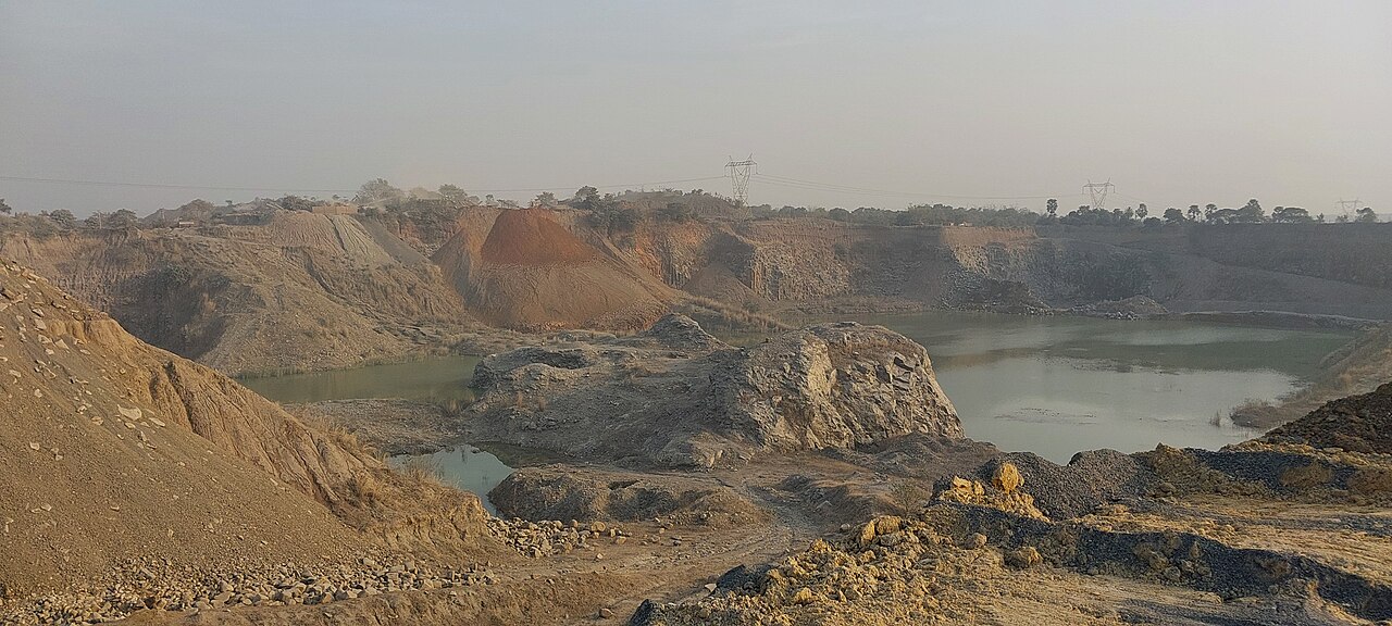 Crushing plant with conveyors and supporting steel structure, industry scene
